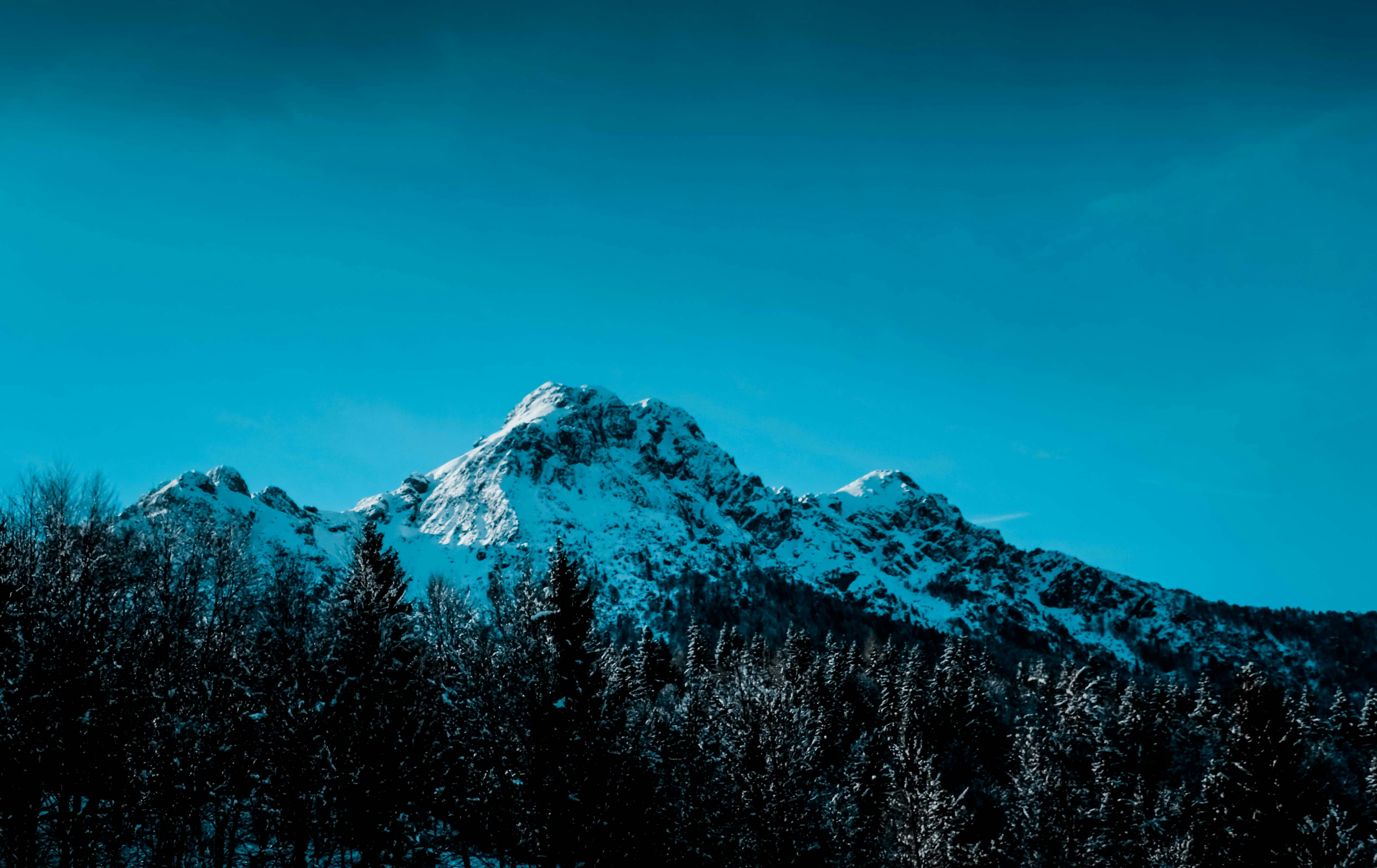 snow covered mountain during daytime